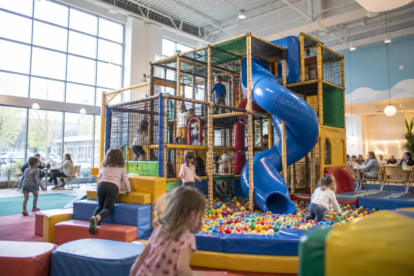A modern commercial indoor playground in operation, the business format priced throughout this indoor playground franchise cost guide